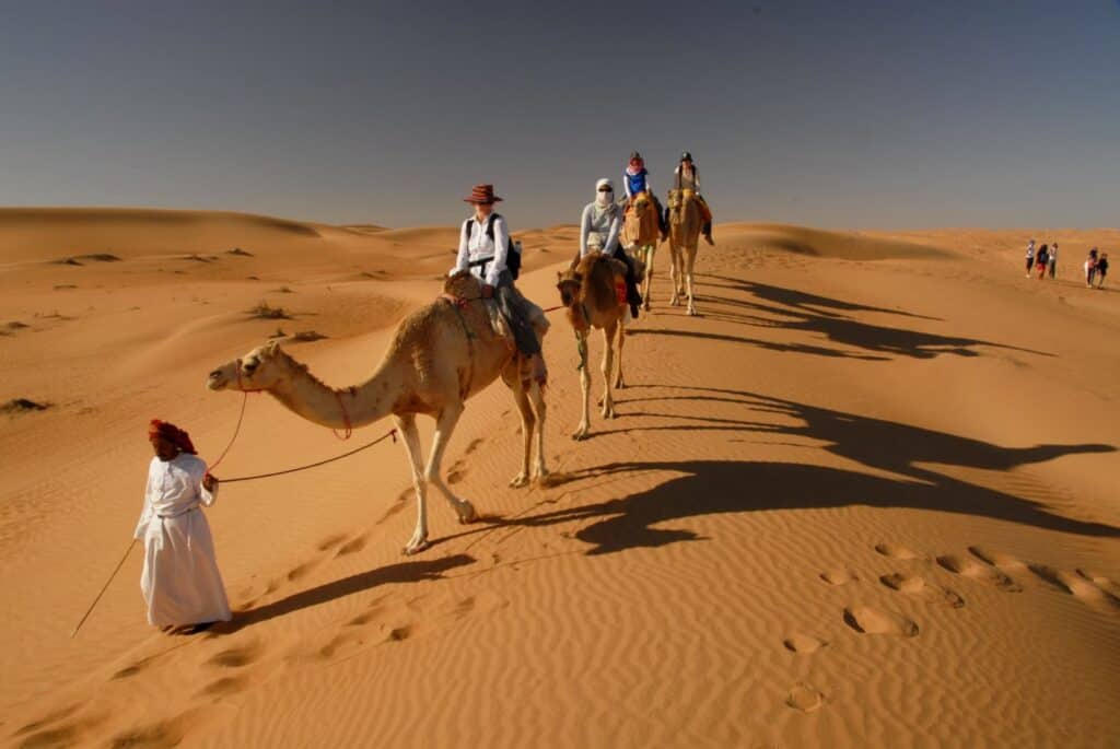 Camel_riding_at_Wahiba_Sands
